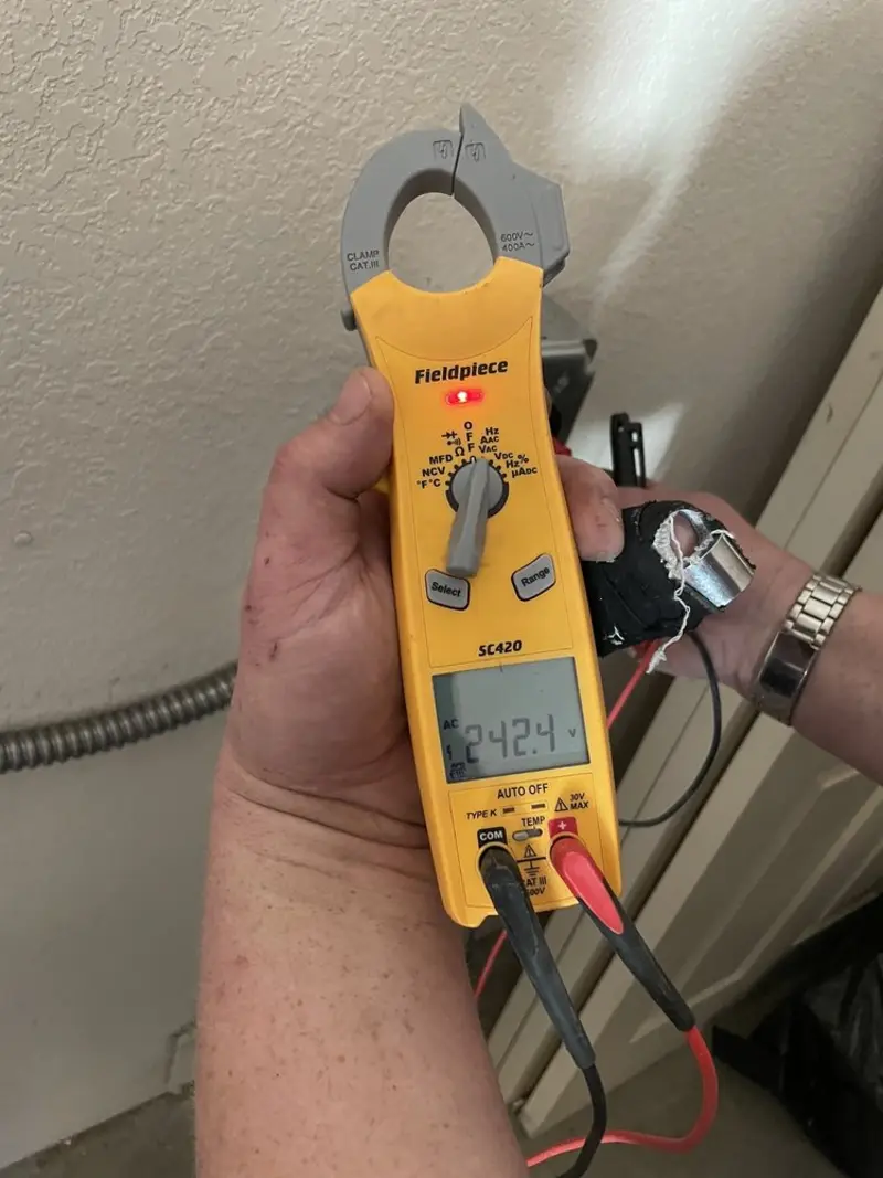 Voltage testing with clamp meter during Recessed Lighting Installation in Claverack
